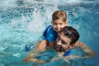 Michael and Boomer having fun in a swim spa